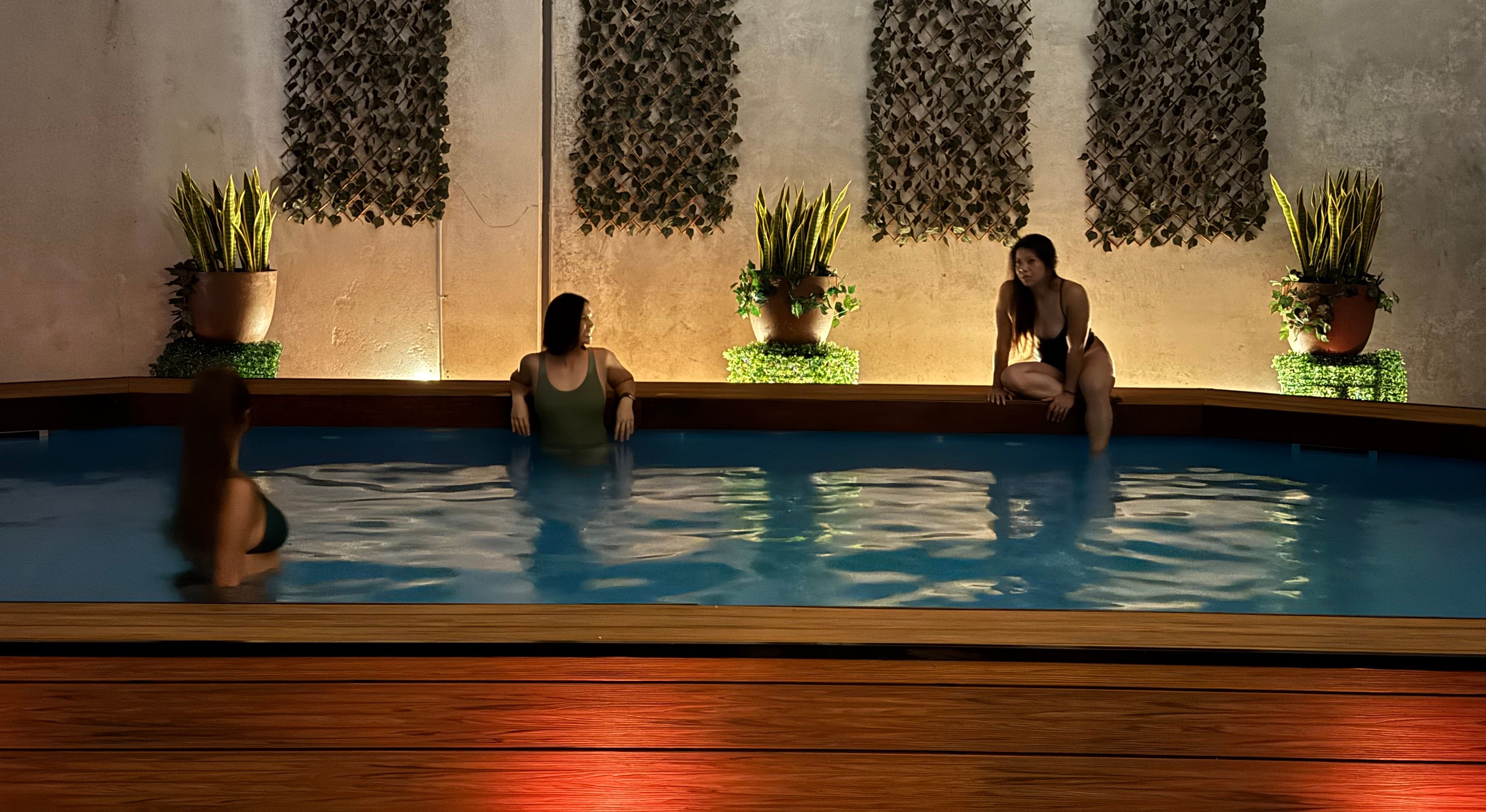Serene spa space at Oasis featuring plunge pools, sauna rooms, and spa baths on a timber deck
