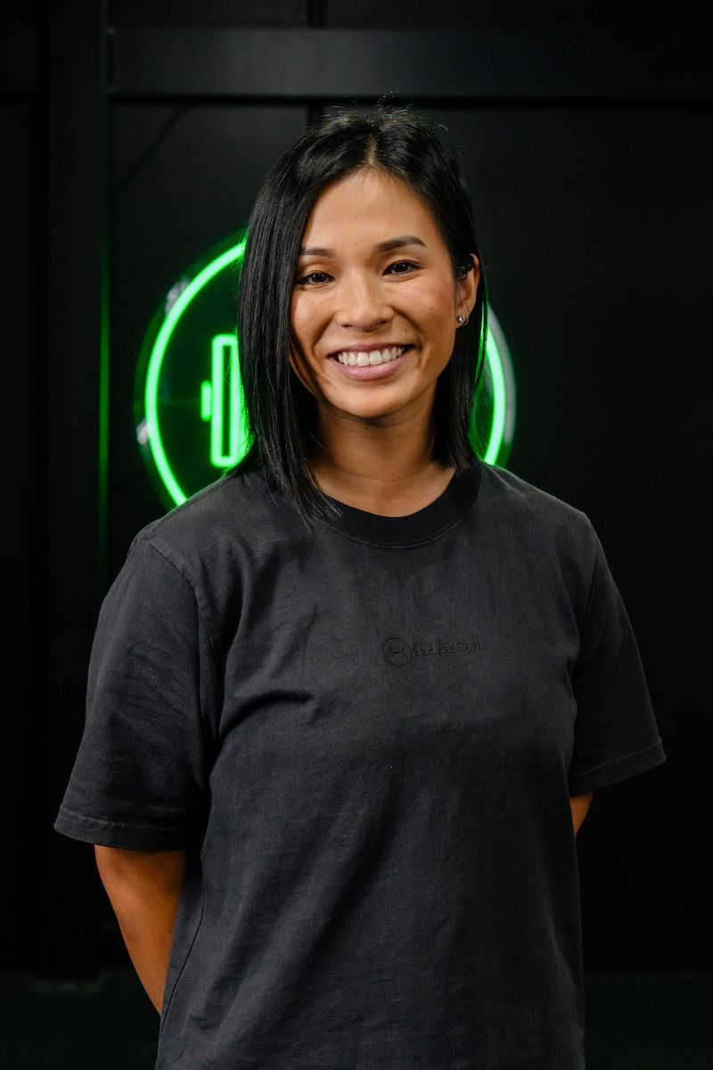 Jeannie Vo, co-founder and general manager at Habitat Gym, smiling inside the Prestons training facility