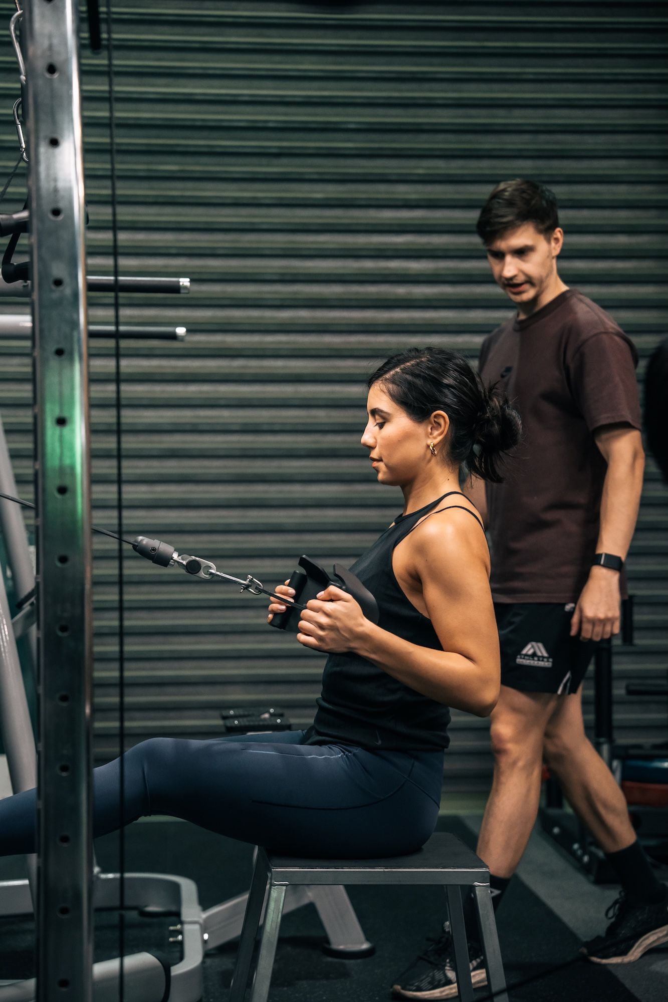 Habitat coach overseeing strength training session in small group fitness program