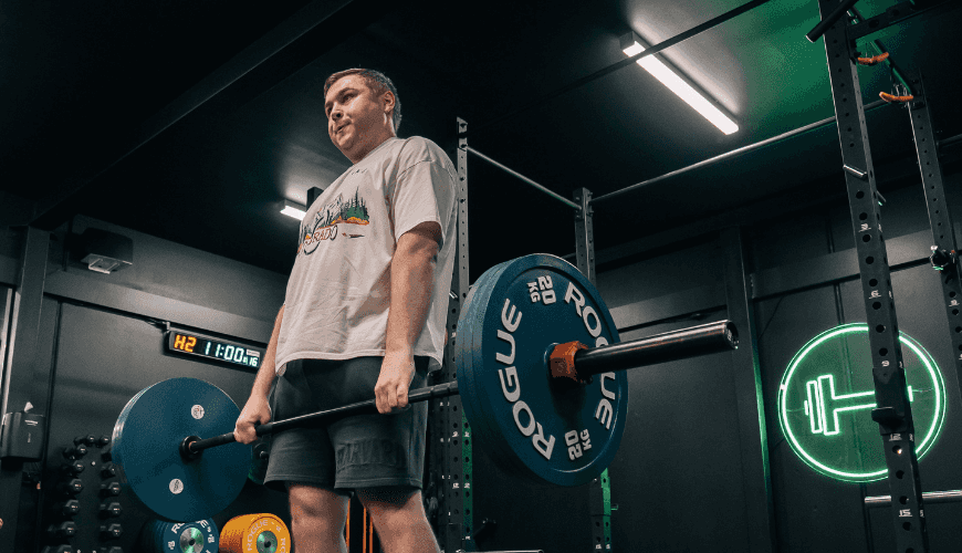 Man deadlifting at Habitat Gym during his workout session